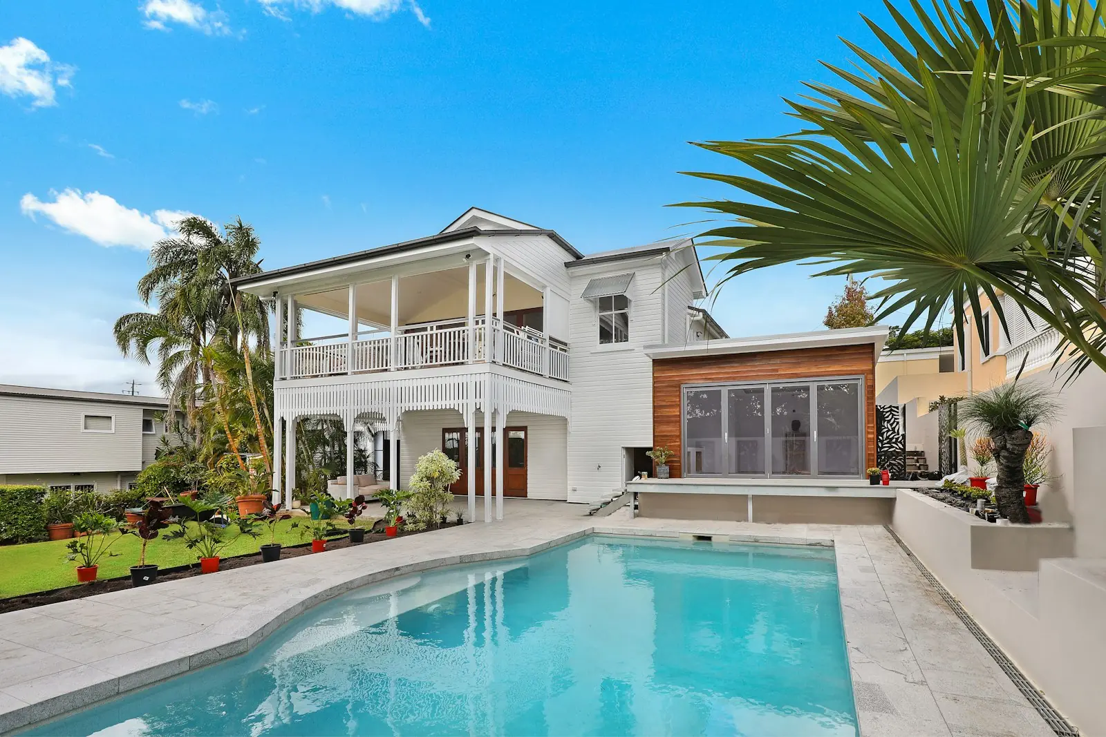 A detached house with a front yard and a driveway